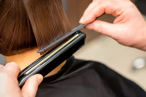 Client receiving a beard trim.