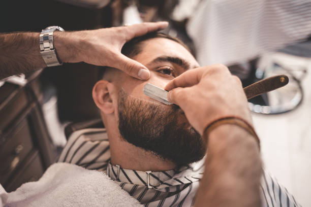 Stylish haircut being finished by a barber.